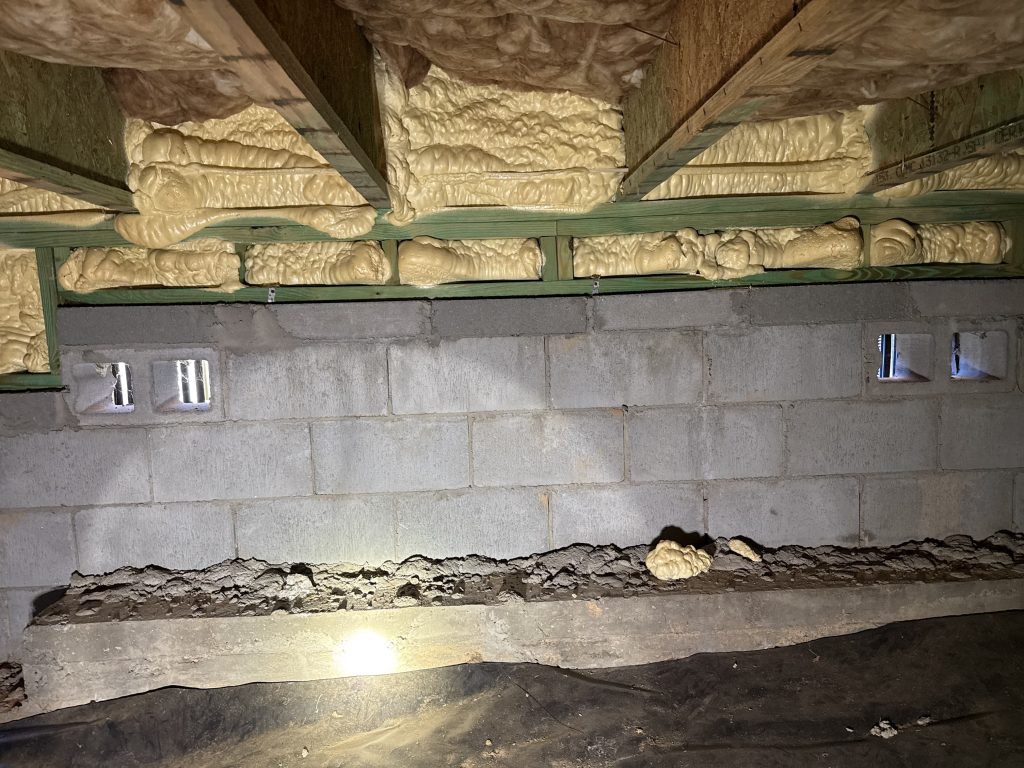 A continuously bearing exterior foundation wall on a modern upstate SC home with closed cell spray foam insulation.