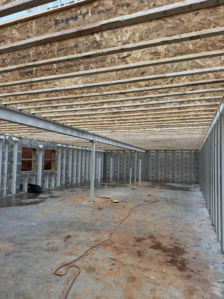 Steel posts and I beam used as the pier and beam foundation on a new upstate SC home.