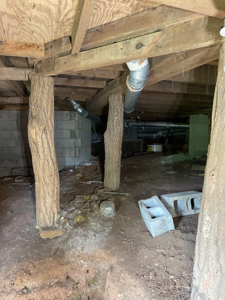a log used as a post on the old portion of an upstate SC home