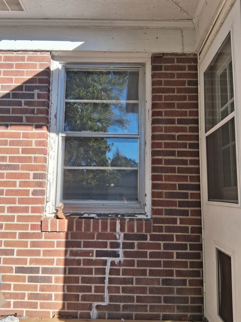 Cracked brick veneer around a window on a Taylors SC home