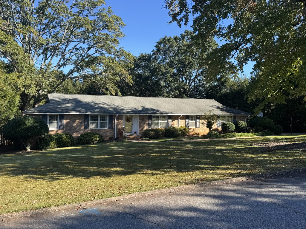 A typical Ranch home in Greer SC with a Hipped roof.
